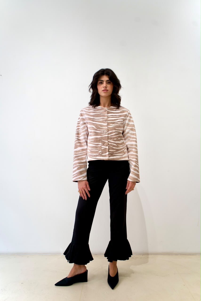 Front styling view of the taupe-and-white zebra OG Jacket with covered buttons and patch pockets