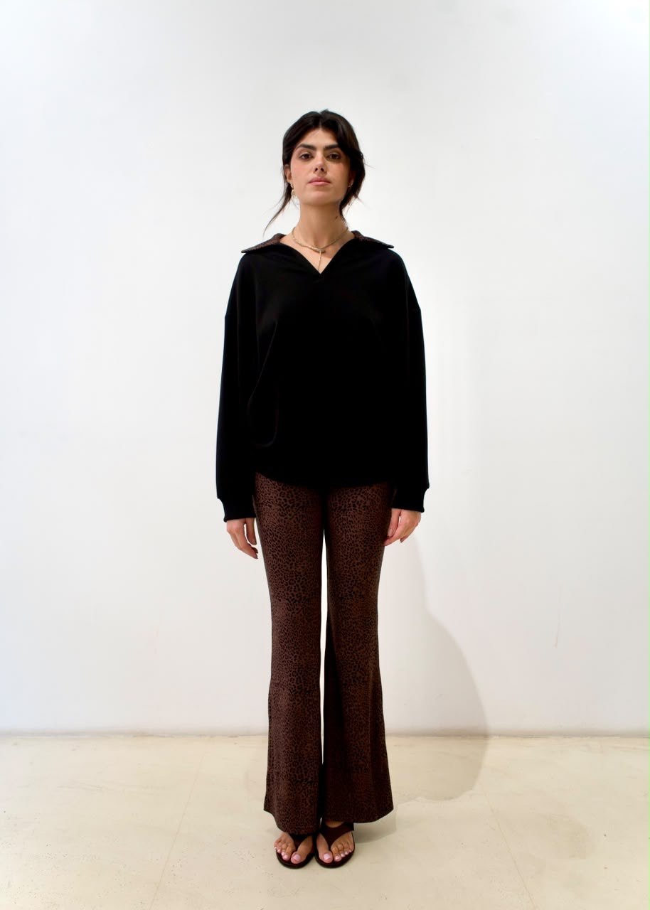 Front styling view of the black long sweater with brown cheetah-print collar
