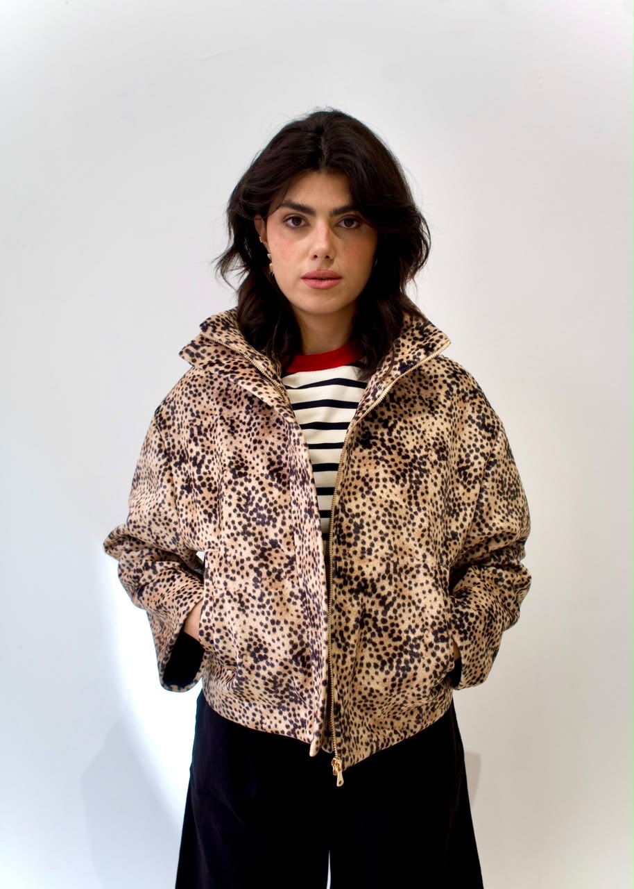 Front styling view of the cheetah-print bomber jacket with raised collar, zip fastening and front pockets