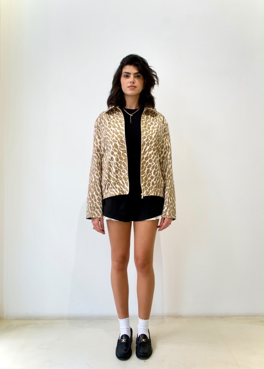 Full-length front styling view of the Golden Cheetah Boy Jacket, worn open over a black top