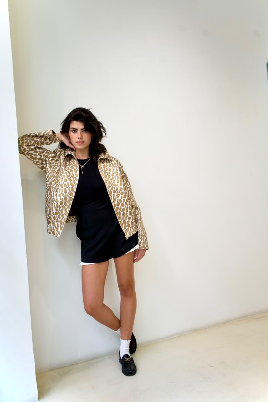 Full-length angled styling view of the Golden Cheetah Boy Jacket, worn open over a black outfit