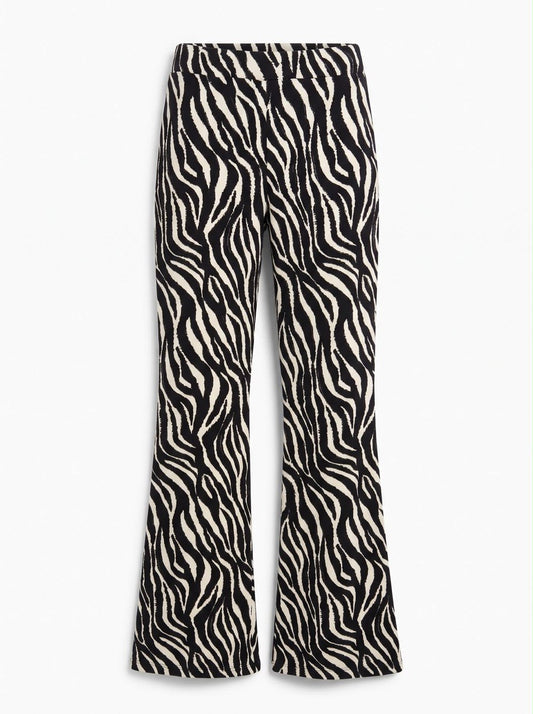 Front flat-lay view of the black-and-white zebra flare pants, showing the waistband and flared hems